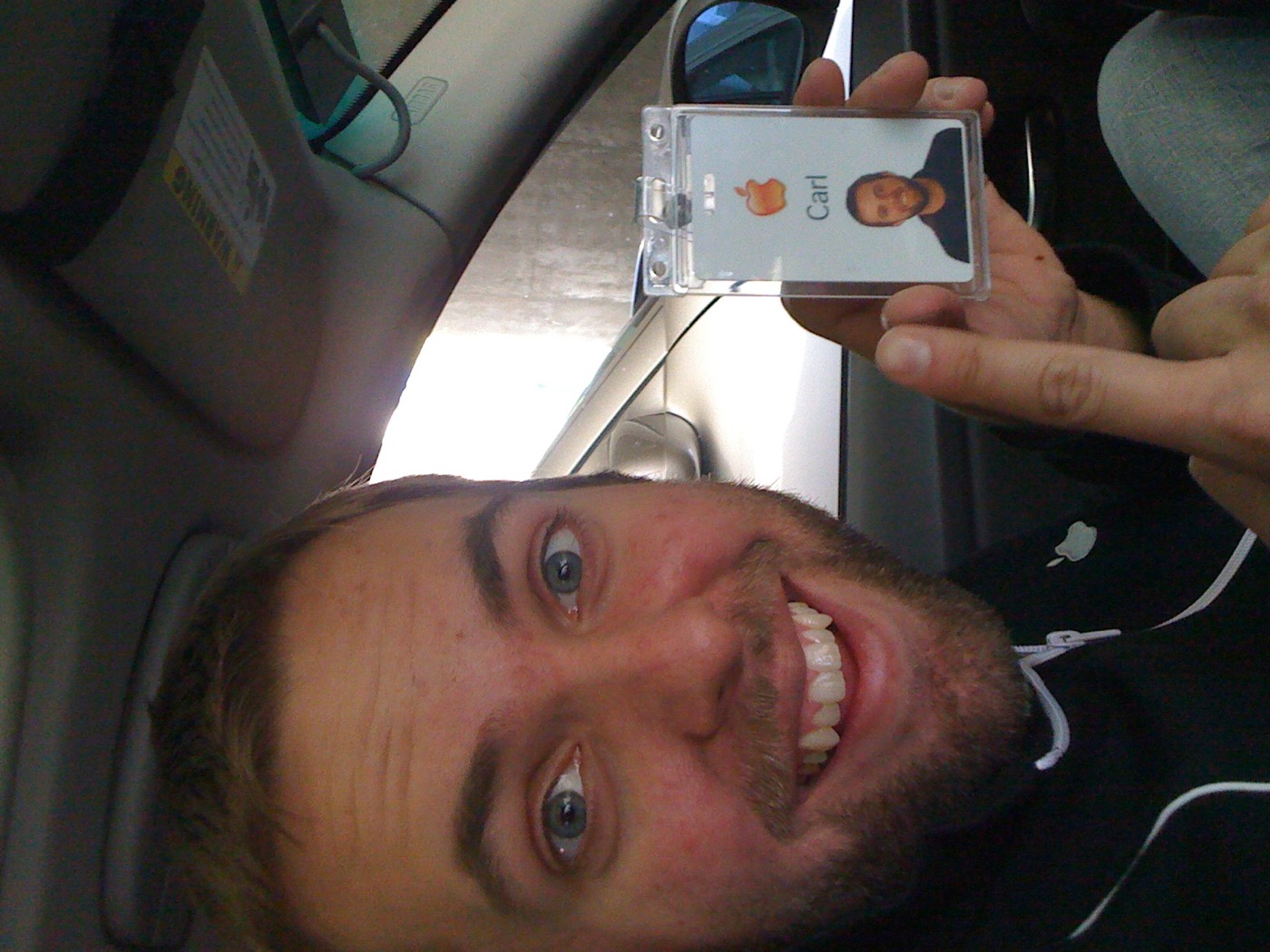 Carl's Apple employee badge, with the Apple logo and his staff photo